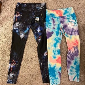 NWT Nike tights. 2 pairs..sz M